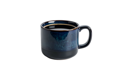 A ceramic mug with dark blue glaze, filled with black liquid, set against a black backdrop