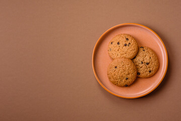 Food, oatmeal chocolate raisin cookies, dessert or breakfast pastry. Oatmeal chocolate cookies