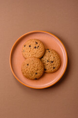 Food, oatmeal chocolate raisin cookies, dessert or breakfast pastry. Oatmeal chocolate cookies