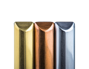 Metallic Columns: A striking visual composition, presenting three sleek, metallic columns in gold, copper, and silver hues, showcasing industrial design