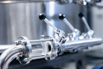 Modern beer factory interior with stainless steel brewing equipment