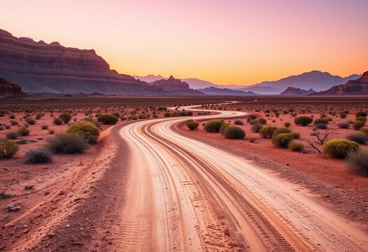 Dusty track winding through arid terrain towards distant mountains, bathed in warm, diffused light,  africa, arid