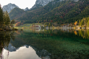 Fototapeta premium Autumn Reflections on a Mountain Lake in the Alps