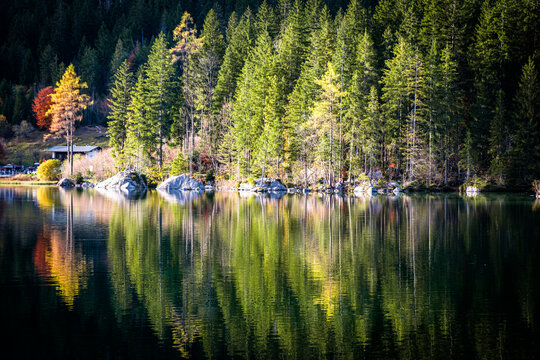 Autumn Reflections on a Mountain Lake in the Alps