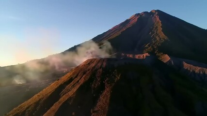 Volcanic mountain peak at sunrise