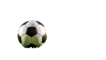 A detailed image of a soccer ball resting on green grass against a black background