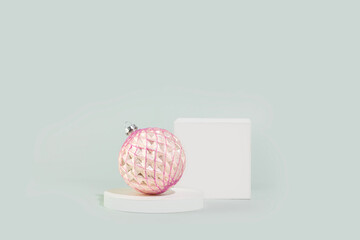 Pink Christmas Ornament On White Podium Scene With Pastel Backdrop. Holiday Display For Presentation, Seasonal Product Promotion, Festive Packaging Mockups, And Elegant Winter Branding Concepts