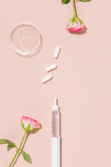 GLP-1 Weight Loss Injection With Pills And Flowers On Soft Pink Background. Concepts Of Weight Loss Therapy, Metabolic Health, Anti-Aging Treatments, Wellness Trends, And Medical Beauty Marketing