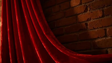 Red Velvet Curtain Drapery Against a Textured Brick Wall with Warm Lighting and Dramatic Shadows creating a Luxurious and Theatrical Ambiance in - Powered by Adobe