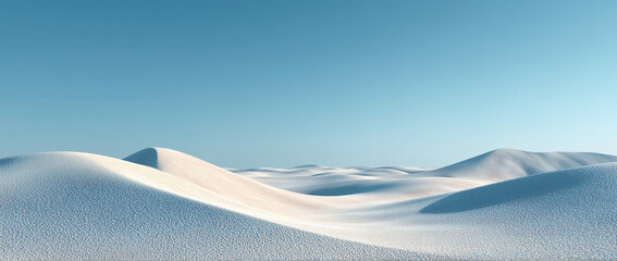 Snowy hills under a clear blue sky on a sunny day with warm sunlight