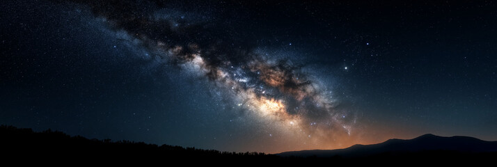 Fototapeta premium A breathtaking panorama of the Milky Way illuminates the night sky, casting a magical glow over a serene mountainous landscape, inspiring awe in nature's majesty.