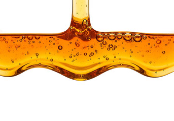 Viscous golden honey dripping and flowing with air bubbles isolated on transparent background