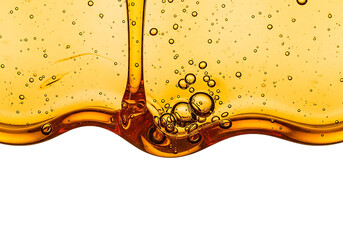 Golden honey or oil pouring and flowing with air bubbles forming a wave isolated on transparent background