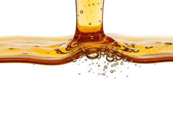 Close up of amber liquid pouring and splashing creating ripples and bubbles isolated on transparent background
