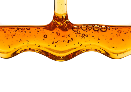 Viscous golden honey dripping and flowing with air bubbles isolated on transparent background