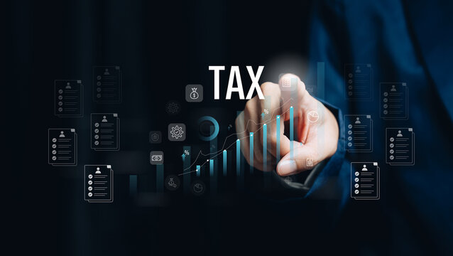 Tax concept with business hand touching digital hologram chart showing financial growth analysis accounting investment and economy management in technology environment