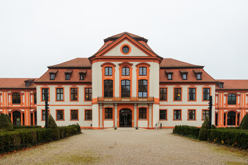 Fototapeta premium Baroque palace facade with central entrance and red roof, Germany, Eichstätt, 7 November 2025