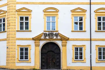 Obraz premium Historic palace facade with ornate portal and heraldic relief, Germany, Eichstätt, 7 November 2025