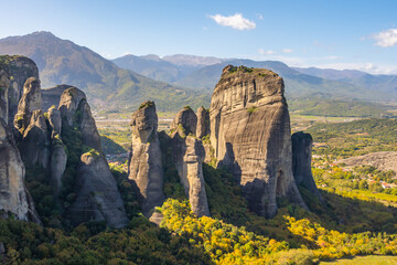 Panoramic View of the Towering Sandstone Pillars of Meteora, Thessaly, Greece, Under a Bright Blue Sky