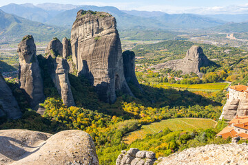 Panoramic View of the Towering Sandstone Pillars of Meteora, Thessaly, Greece, with Monastery Buildings and Autumn Colors in the Valley