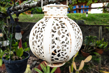 White decorative outdoor solar-powered lantern in Moroccan style