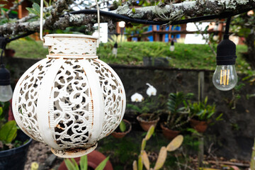 White decorative outdoor solar-powered lantern in Moroccan style