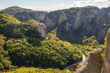 Panoramic View of Meteora Monasteries High on Rock Pillars Above the Lush Green Valley in Kalampaka, Greece