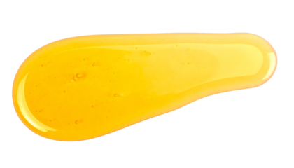 Golden honey dripping, smearing luscious natural liquid creating sweet delicious sticky dessert food texture on white