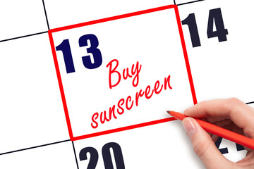 13 th day of the month.  Hand writing Buy sunscreen reminder and drawing red frame on calendar. Concept skin care, health care. Travel planning concept. Planning and scheduling