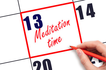 13 th day of the month.  Hand writing Meditation time reminder and drawing red frame on calendar...