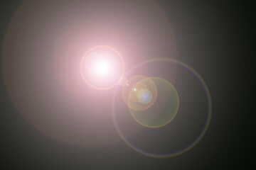 Abstract background vector design with glowing blue circles and a bright lens flare