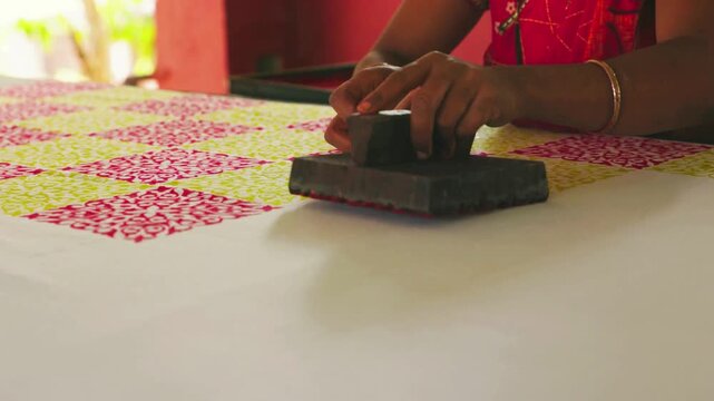 Close Shot of Hands Printing on Linen with Wooden Block in Workshop &mdash; Artisan Creating Traditional Handcrafted Textile Design, Block Printing Process, and Cultural Fabric Art in 4K Ultra HD