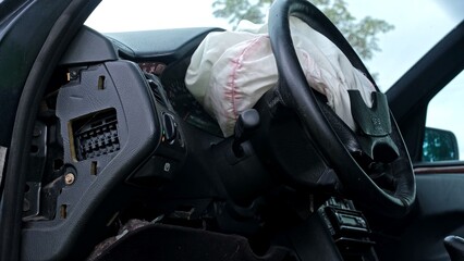 Damaged Car Interior with Deployed Airbag after Road Crash Accident 