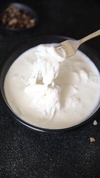 Stracciatella cheese soft young portion size Italian food natural product tasty snack fresh delicious gourmet food background on the table rustic top view copy space