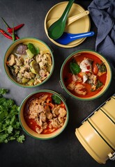 Authentic Thai Curries in Traditional Food Carriers (Pinto)
