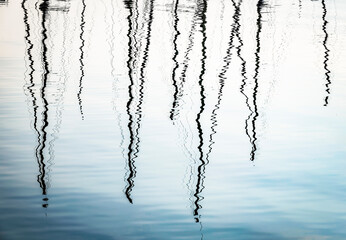 Boats abstract reflexion over the surface of Como Lake, Lombardy, Italy
