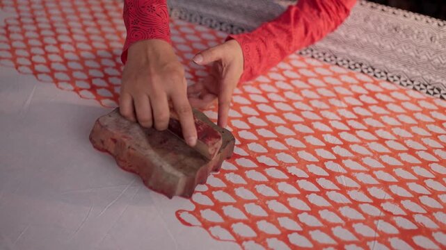 Close Shot of Hands Printing on Linen with Wooden Block in Workshop &mdash; Artisan Creating Traditional Handcrafted Textile Design, Block Printing Process, and Cultural Fabric Art in 4K Ultra HD