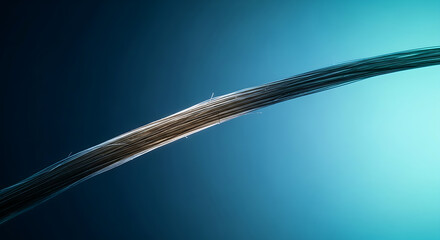 Macro Shot of a Braided Cable Wire Against a Gradient Blue Background