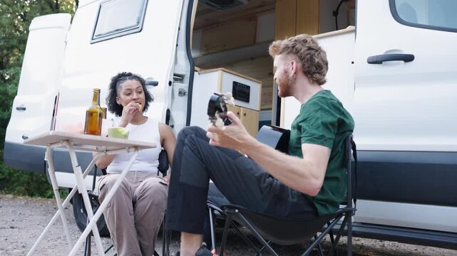 Millennial couple enjoying van life road trip
