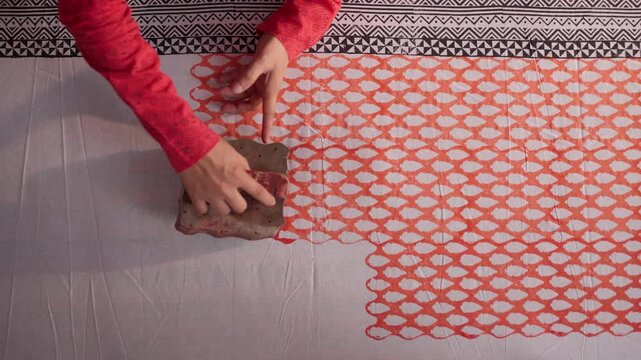 Close Shot of Hands Printing on Linen with Wooden Block in Workshop &mdash; Artisan Creating Traditional Handcrafted Textile Design, Block Printing Process, and Cultural Fabric Art in 4K Ultra HD