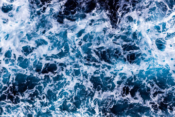 Ocean surface texture. Top view of captivating water with foam. Can be used in covers, packaging, posters, textures, cards, art and design projects. Mesmerizing vector illustration.