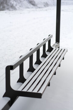 Bench in the snow, bus stop, winter day, snow, gray day, sign, frost, white, road, view, nature