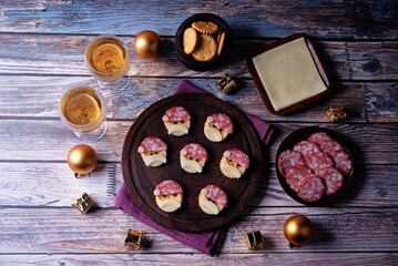 Salami sausage and cheese slices and crackers in the form of Santa Claus for Christmas holidays