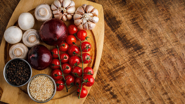 Fresh Vegetables and Spices on Wooden Board, Top View