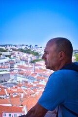 man looking at the city view