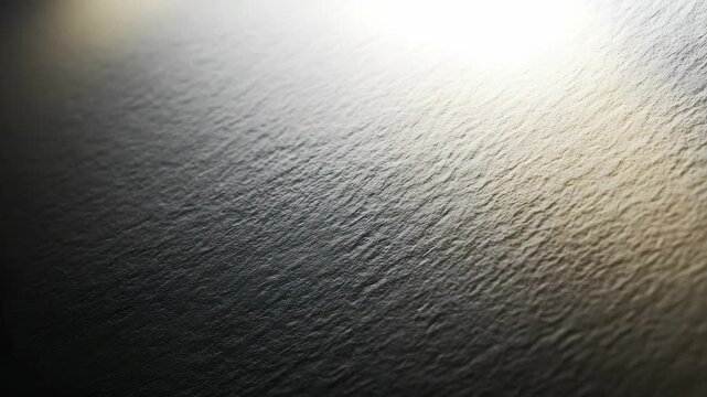 Serene water texture with subtle waves and a smooth gradient effect, ideal for backgrounds or nature inspired visuals. This tranquil scene evokes peace and contemporary aesthetics