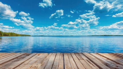 Obraz premium A serene lake scene features a wooden dock extending over calm waters. Fluffy white clouds drift across a bright blue sky, reflecting the tranquility of nature. Perfect for relaxation.