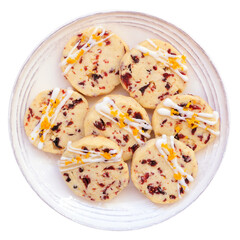 Christmas holiday cranberry orange icebox cookies. Above view plate isolated on a white background.
