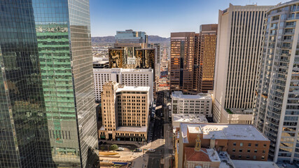 Panoramic aerial view of downtown Phoenix s skyline. Gleaming skyscrapers dominate the frame against a clear blue sky. Urban landscape, modern architecture, cityscape, Arizona.