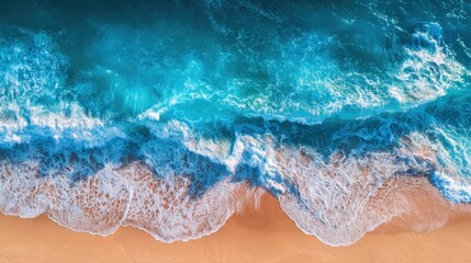 Obraz premium Vibrant turquoise waves roll onto a sandy shore as sunlight illuminates the scene, creating a picturesque view of nature in a coastal paradise.